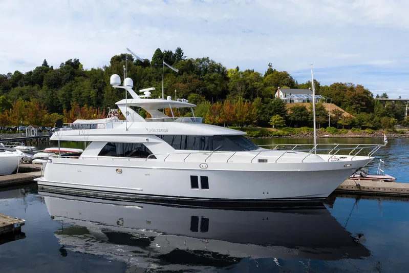 Whitefish Yacht Photos Pics 2013 Ocean Alexander 72 Pilothouse yacht docked in a scenic marina setting.
