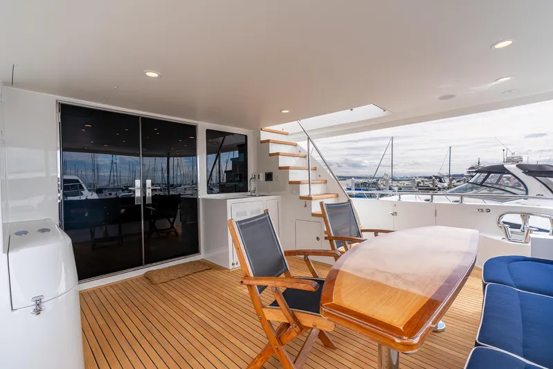 Whitefish Yacht Photos Pics Luxurious 2013 Ocean Alexander 72 Pilothouse yacht deck with seating and marina view.