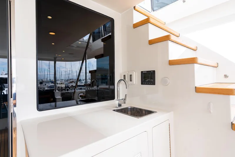 Whitefish Yacht Photos Pics Ocean Alexander 72 Pilothouse 2013 yacht interior with sink and wooden stairs.