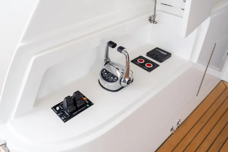 Whitefish Yacht Photos Pics Control panel of 2013 Ocean Alexander 72 Pilothouse yacht with throttle and switches.