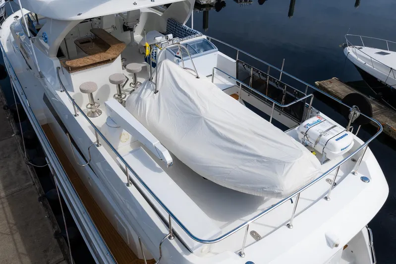 Whitefish Yacht Photos Pics 2013 Ocean Alexander 72 Pilothouse yacht with covered deck and seating area.