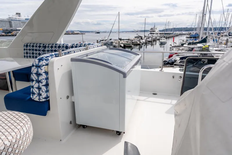 Whitefish Yacht Photos Pics 2013 Ocean Alexander 72 Pilothouse yacht deck with seating and marina view.