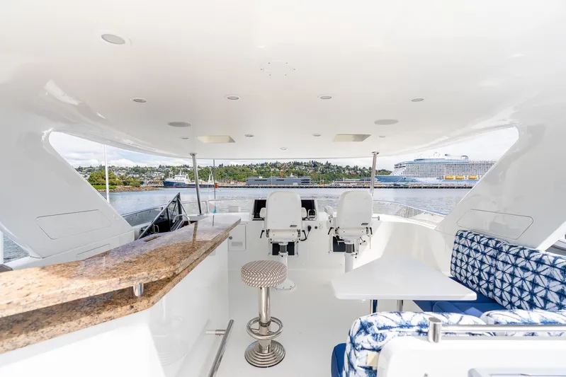 Whitefish Yacht Photos Pics Luxurious 2013 Ocean Alexander 72 Pilothouse yacht interior with seating and helm, overlooking marina.