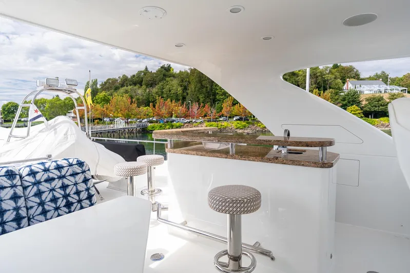 Whitefish Yacht Photos Pics Luxurious 2013 Ocean Alexander 72 Pilothouse yacht with outdoor seating and bar area.