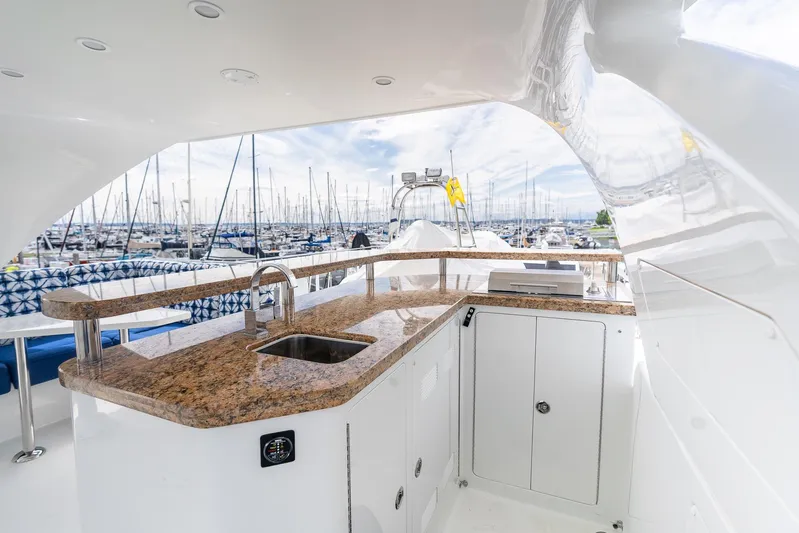 Whitefish Yacht Photos Pics Luxurious 2013 Ocean Alexander 72 Pilothouse yacht with elegant outdoor bar and marina view.