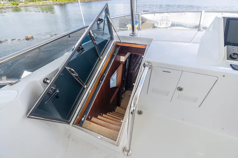 Whitefish Yacht Photos Pics Stairway entrance on 2013 Ocean Alexander 72 Pilothouse yacht, featuring sleek design and water view.