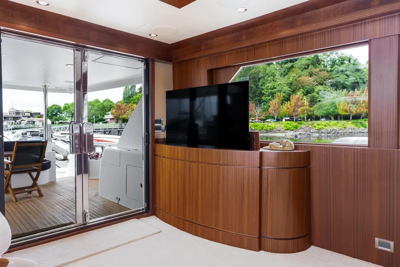 Whitefish Yacht Photos Pics Luxurious interior of 2013 Ocean Alexander 72 Pilothouse yacht with wood paneling and large window.