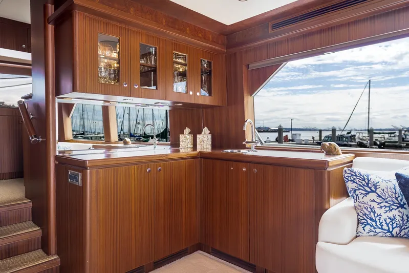 Whitefish Yacht Photos Pics Luxurious 2013 Ocean Alexander 72 Pilothouse yacht interior with elegant wood cabinetry and marina view.