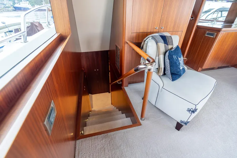 Whitefish Yacht Photos Pics Luxurious interior of 2013 Ocean Alexander 72 Pilothouse yacht with elegant staircase and seating.