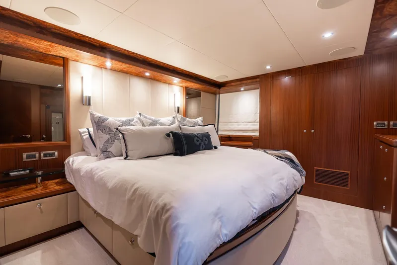 Whitefish Yacht Photos Pics Luxurious bedroom interior of 2013 Ocean Alexander 72 Pilothouse yacht with elegant wood finishes.