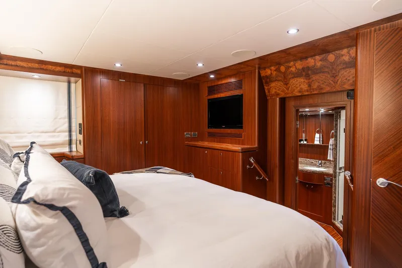 Whitefish Yacht Photos Pics Luxurious bedroom in 2013 Ocean Alexander 72 Pilothouse yacht with elegant wood finishes.