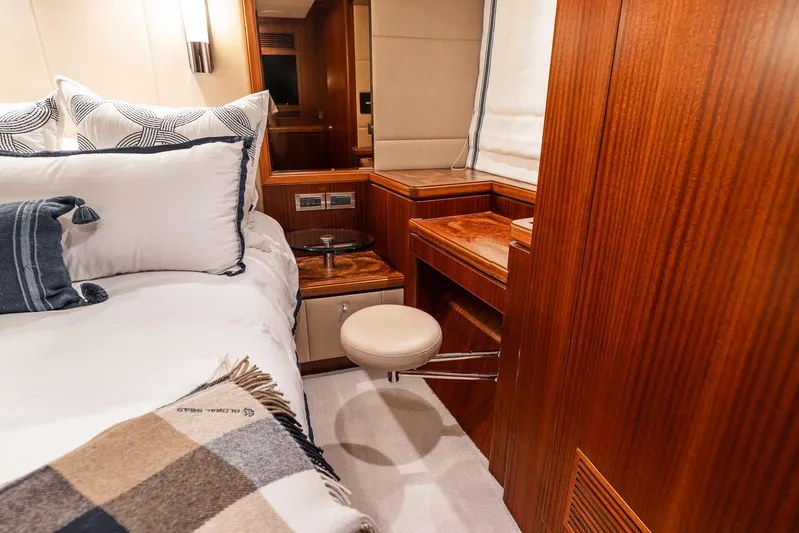 Whitefish Yacht Photos Pics Luxurious bedroom interior of 2013 Ocean Alexander 72 Pilothouse yacht with elegant wood finish.