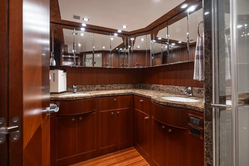 Whitefish Yacht Photos Pics Luxurious bathroom in 2013 Ocean Alexander 72 Pilothouse yacht with wood cabinetry and marble countertops.