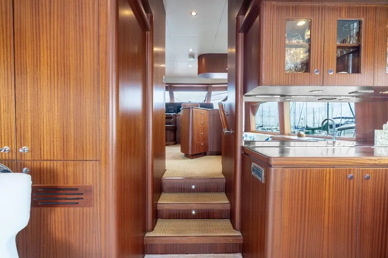 Whitefish Yacht Photos Pics Luxurious interior of 2013 Ocean Alexander 72 Pilothouse yacht with wood finishes and modern amenities.