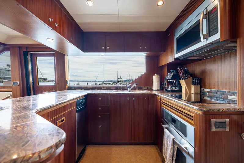 Whitefish Yacht Photos Pics Luxurious kitchen interior of 2013 Ocean Alexander 72 Pilothouse yacht with modern appliances.
