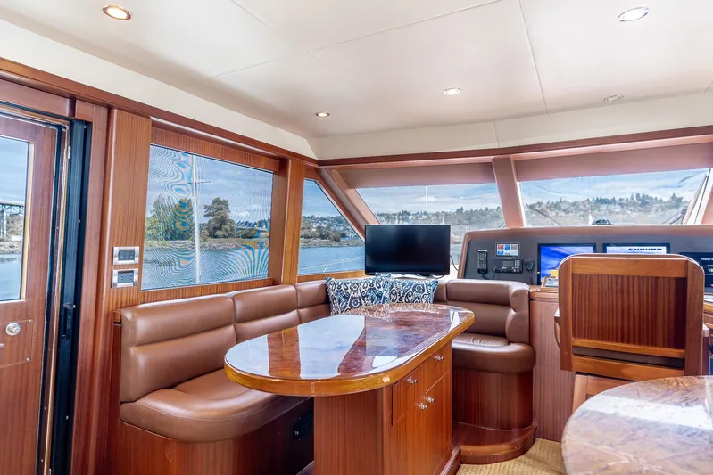 Whitefish Yacht Photos Pics Luxurious interior of 2013 Ocean Alexander 72 Pilothouse yacht with leather seating and wood finishes.
