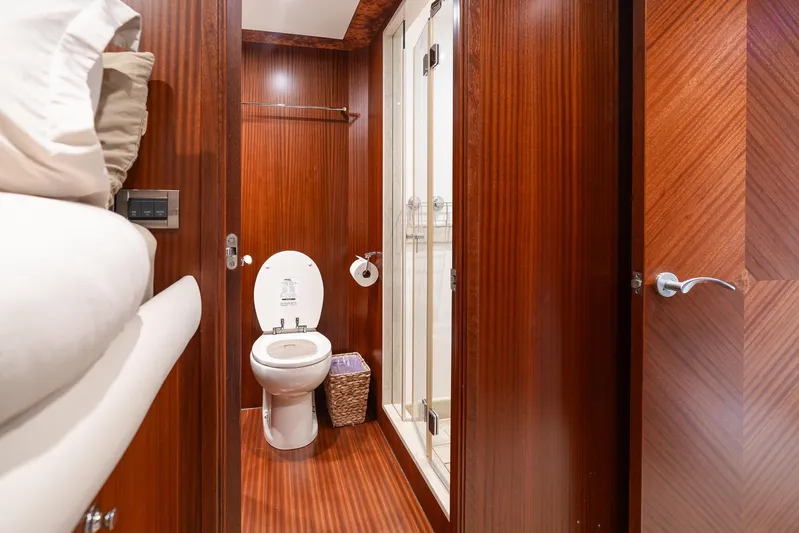 Whitefish Yacht Photos Pics Luxurious bathroom in 2013 Ocean Alexander 72 Pilothouse yacht with wood paneling and modern fixtures.