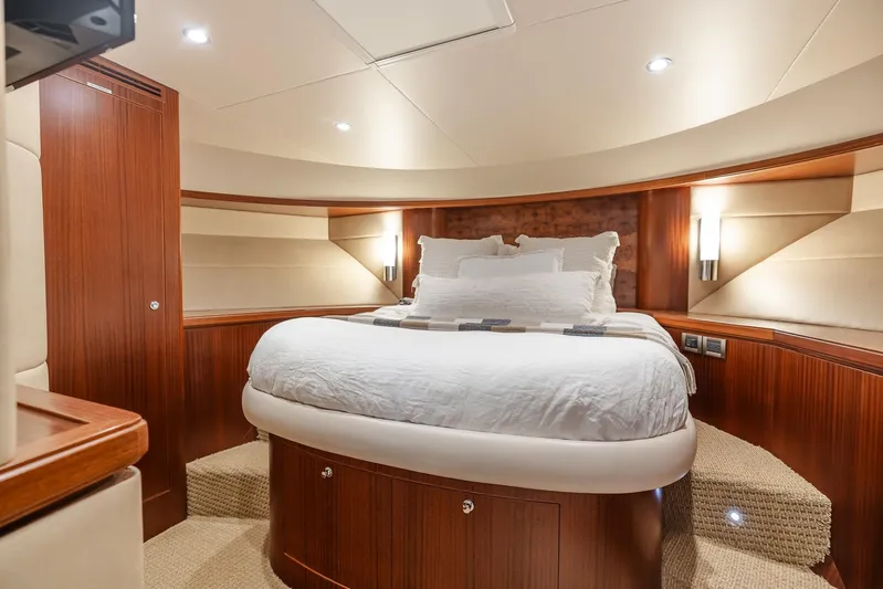 Whitefish Yacht Photos Pics Luxurious bedroom interior of 2013 Ocean Alexander 72 Pilothouse yacht with elegant wood finishes.