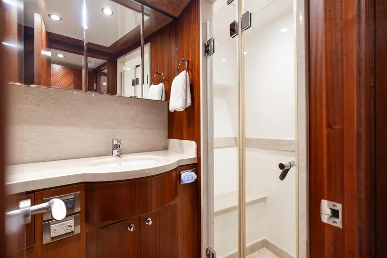 Whitefish Yacht Photos Pics Luxurious bathroom in 2013 Ocean Alexander 72 Pilothouse yacht with wood accents and modern fixtures.