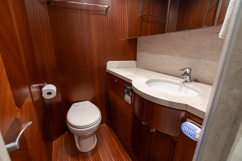 Whitefish Yacht Photos Pics Luxurious bathroom in 2013 Ocean Alexander 72 Pilothouse yacht with wood finish and modern fixtures.