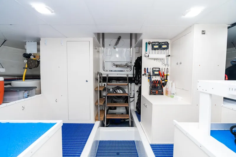 Whitefish Yacht Photos Pics Engine room of 2013 Ocean Alexander 72 Pilothouse with organized tools and equipment.