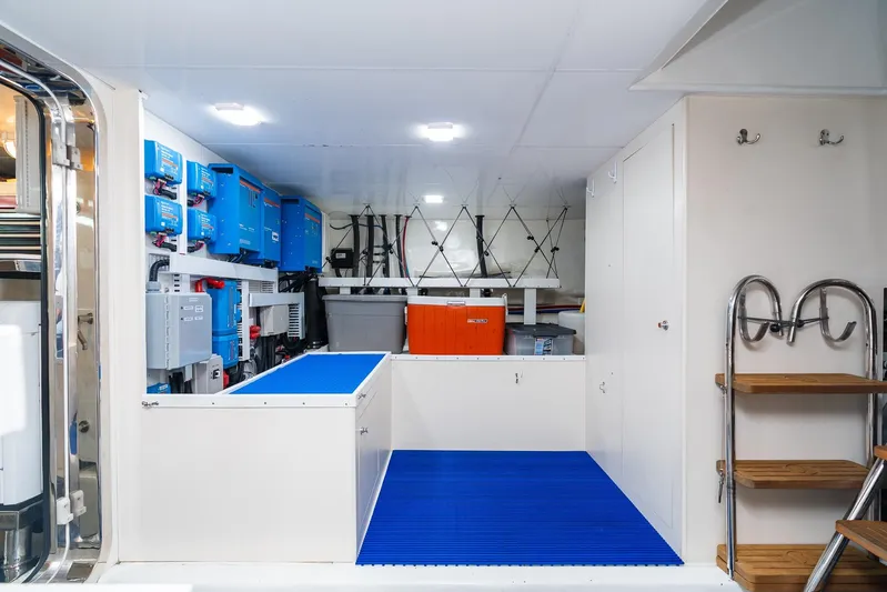 Whitefish Yacht Photos Pics Engine room of 2013 Ocean Alexander 72 Pilothouse yacht with equipment and storage.