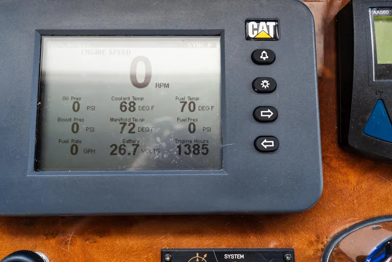 Whitefish Yacht Photos Pics Control panel of a 2013 Ocean Alexander 72 Pilothouse displaying engine metrics.