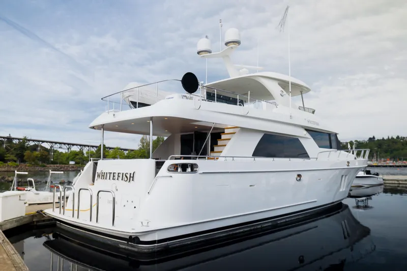 Whitefish Yacht Photos Pics Luxury 2013 Ocean Alexander 72 Pilothouse yacht docked, featuring sleek design and spacious decks.
