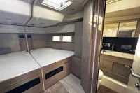 Luxurious 2017 Hanse 548 yacht cabin with modern interior and ensuite bathroom.