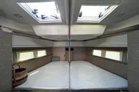 Luxurious interior cabin of 2017 Hanse 548 yacht with skylights and modern design.