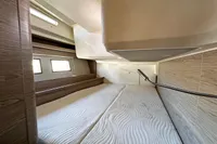 Interior cabin of 2017 Hanse 548 yacht with modern design and comfortable bedding.