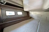 Interior cabin of 2017 Hanse 548 yacht with modern design and comfortable bedding.
