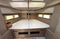 Luxurious interior cabin of 2017 Hanse 548 yacht with twin beds and skylights.