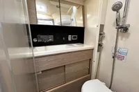 Modern bathroom in 2017 Hanse 548 yacht with shower, sink, and toilet.