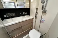 Modern bathroom in 2017 Hanse 548 yacht with shower, sink, and toilet.