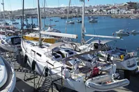 Hanse 548 sailboats docked at a marina, 2017 model, with scenic waterfront view.