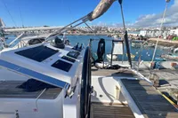 2017 Hanse 548 yacht docked at a marina, featuring a sleek deck and modern controls.