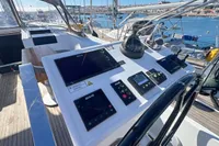 Cockpit of 2017 Hanse 548 yacht with navigation instruments and steering wheel.