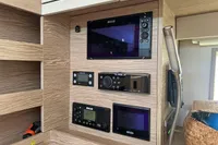 Control panel of a 2017 Hanse 548 yacht with navigation and communication equipment.