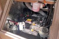 Engine compartment of a 2017 Hanse 548 yacht, showcasing mechanical components and wiring.