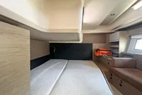 Cabin interior of 2017 Hanse 548 yacht with bed and medical kit.