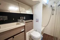 Bathroom interior of 2017 Hanse 548 yacht with shower, sink, and toilet.