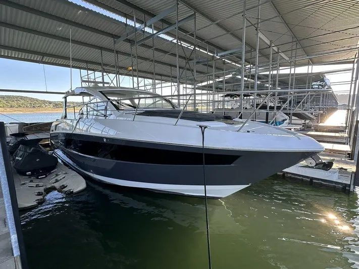  Yacht Photos Pics 2021 Cruisers Yachts 39 Express Coupe docked in a marina.