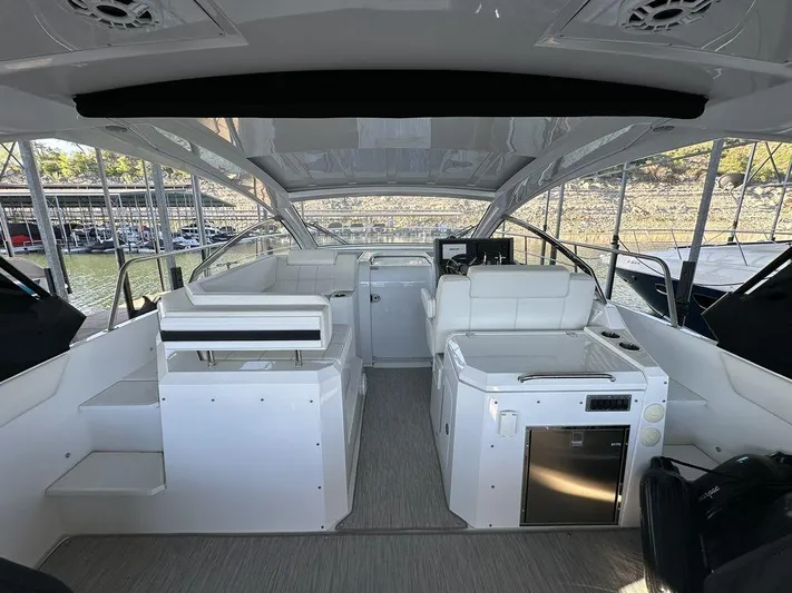  Yacht Photos Pics 2021 Cruisers Yachts 39 Express Coupe interior with modern seating and sleek design.