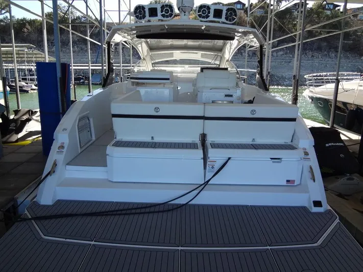  Yacht Photos Pics 2021 Cruisers Yachts 39 Express Coupe docked, showcasing spacious rear deck and seating area.