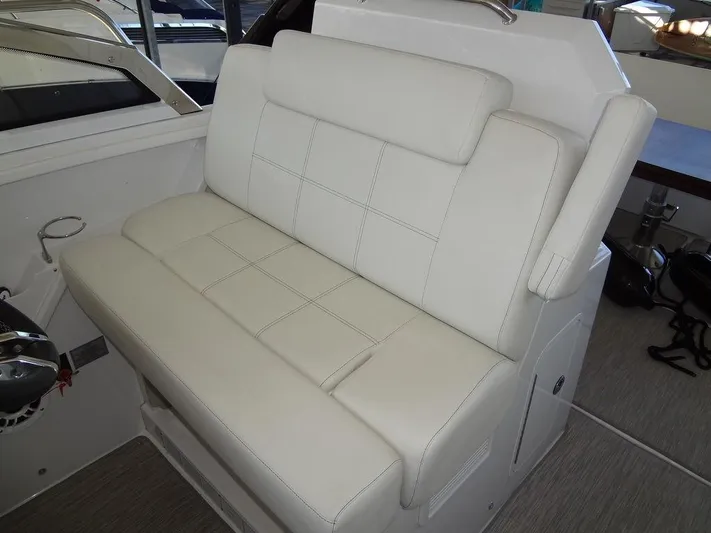 Yacht Photos Pics 2021 Cruisers Yachts 39 Express Coupe, white leather seating detail.