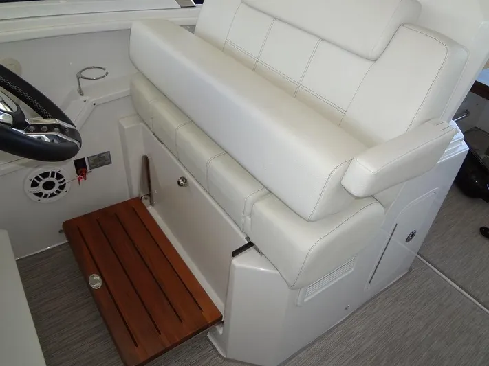  Yacht Photos Pics 2021 Cruisers Yachts 39 Express Coupe interior seating with wooden footrest.