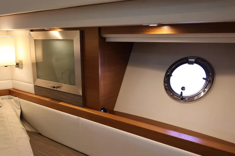 Lady Linn Yacht Photos Pics Interior of 2020 Tiara Yachts C44 Coupe with porthole and modern design elements.