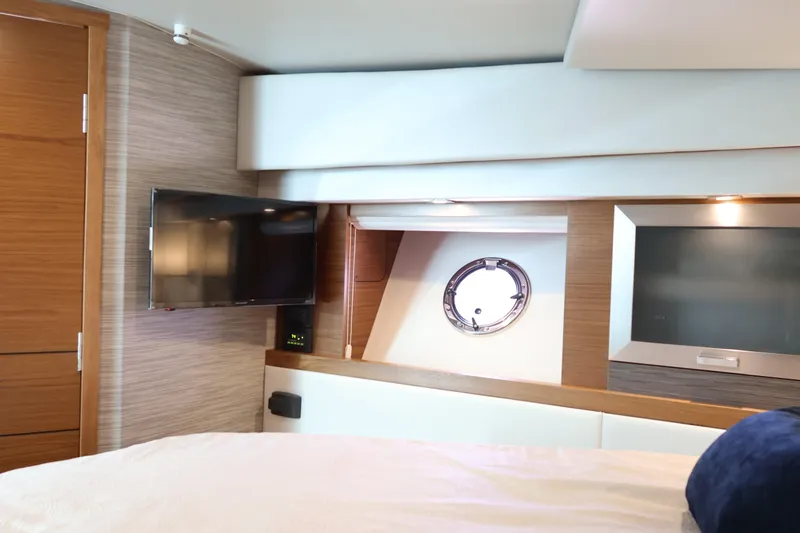Lady Linn Yacht Photos Pics Interior of 2020 Tiara Yachts C44 Coupe with TV and porthole window.