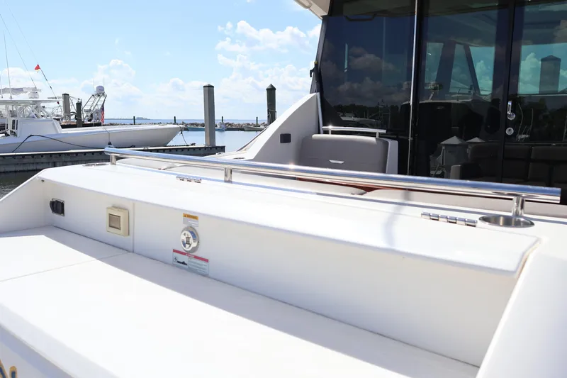 Lady Linn Yacht Photos Pics 2020 Tiara Yachts C44 Coupe at marina, showcasing sleek deck and modern design.